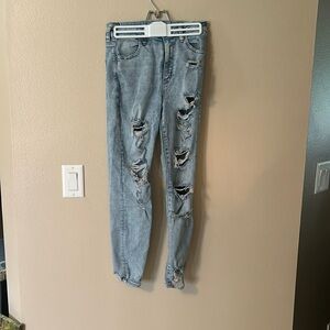 Ripped light wash blue jeans